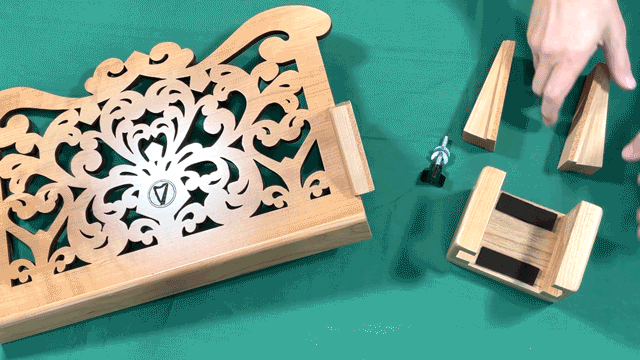 Animated gif showing wedges being inserted in harp desk bracket
