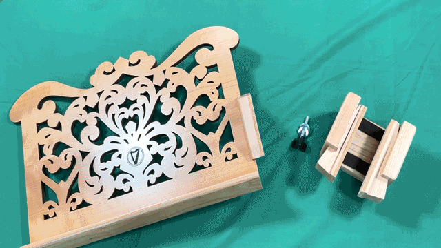 Animated gif of the harp desk bracket being attached to the desk